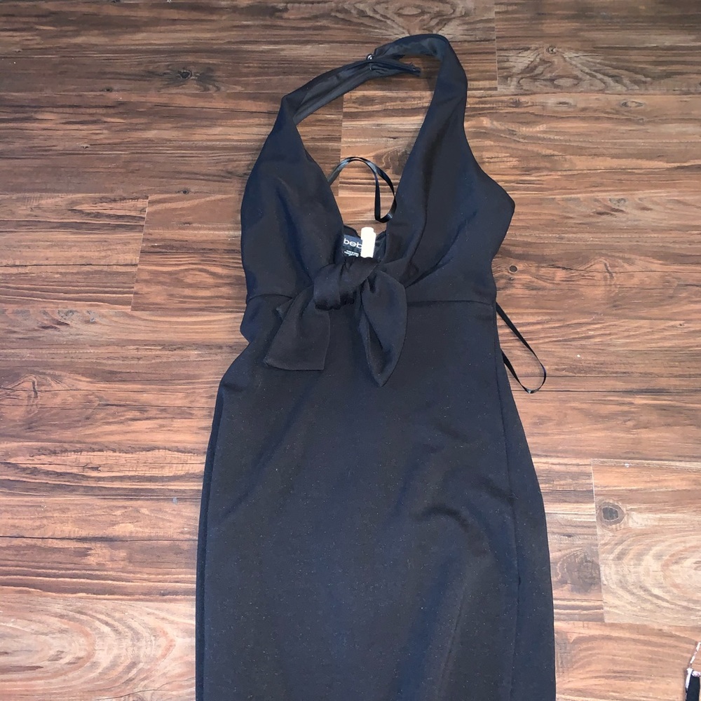 Black bodycon low cut Bebe dress with bow